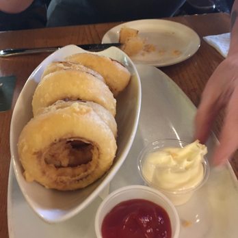Six Mile Pub & Eatery - Hot and delicious fat cut onion rings in a gluten free tempura like batter. - Pubs Near Me - Victoria, British Columbia Six Mile Pub & Eatery - Hot and delicious fat cut onion rings in a gluten free tempura like batter. - Pubs Near Me - Victoria, British Columbia