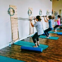 Hana Pilates & Bodyworks - Strengthening the quads for protect the knees and building bicep strength at the same time. Win/ win!