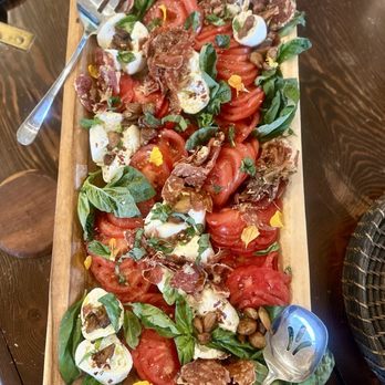 Cuisine By Lela - Burrata, fresh tomatoes, basil, and crisp salami and prosciutto with homemade crostinis - Personal Chefs Near Me