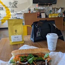 Coffee beans, latte, and pork banh mi. Coffee beans, latte, and pork banh mi.