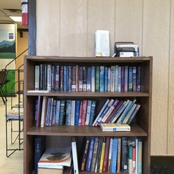 Kosse Cafe - Little library by the front counter. :)