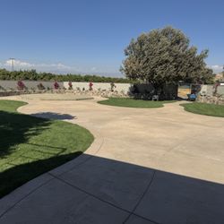 American Concrete Specialists - stamped colored concrete ,block wall, retaining wall, integradted lighting and raised platform.