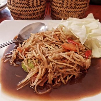 Thai Cuisine - Papaya Salad Laod Style. Wish it came with some pork rinds. Orders of sticky rice come in a little basket. - Thai Near Me - Merced, California