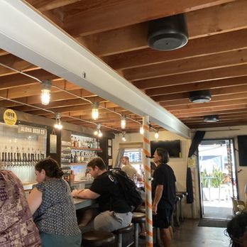 Aloha Beer - Bar and tables inside with a side patio for more seating - Breweries Near Me - Honolulu, Hawaii