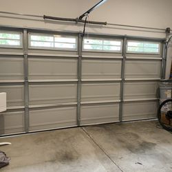 Garage Door Doctor - Garage door after accident. Daniel smoothed out the dent, made the movement smoother, and charged a very fair price.