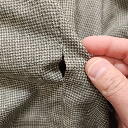 Seam opened along the back Seam opened along the back