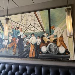 Brighton Bar & Grill - Beautiful painting of an old car assembly line. Hard working American's wanting to live the dream.