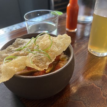 Nolia - STEWED OKRA with tomatoes, jimmy red corn grits and a local beer. They have a sauce "that goes on everything" - Southern Near Me - Cincinnati, Ohio