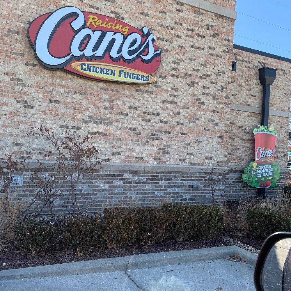 Raising Cane's Chicken Fingers - a side view of the building - Fast Food Near Me - Naperville, Illinois Raising Cane's Chicken Fingers - a side view of the building - Fast Food Near Me - Naperville, Illinois