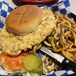 Lucy's Bar and Grill - Pork tenderloin sandwich and homemade curly q fries