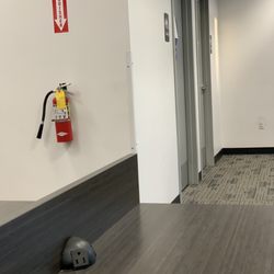 FedEx Office Print & Ship Center - Door to the restroom, other door entrance to the staff only work area .