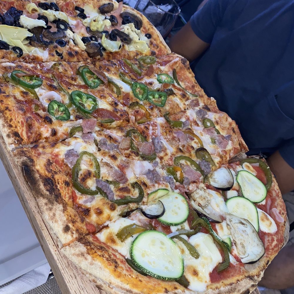 1/2 metro pizza with cappriccosa, Pisa, vegetariana, and mexicana. 1/2 metro pizza with cappriccosa, Pisa, vegetariana, and mexicana.