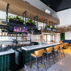 Contract Furniture Company - Jack's on Pearl in Denver adorned their beautiful new restaurant with our Malmo Chairs and Stools in Custom Fabric chosen by their designer!