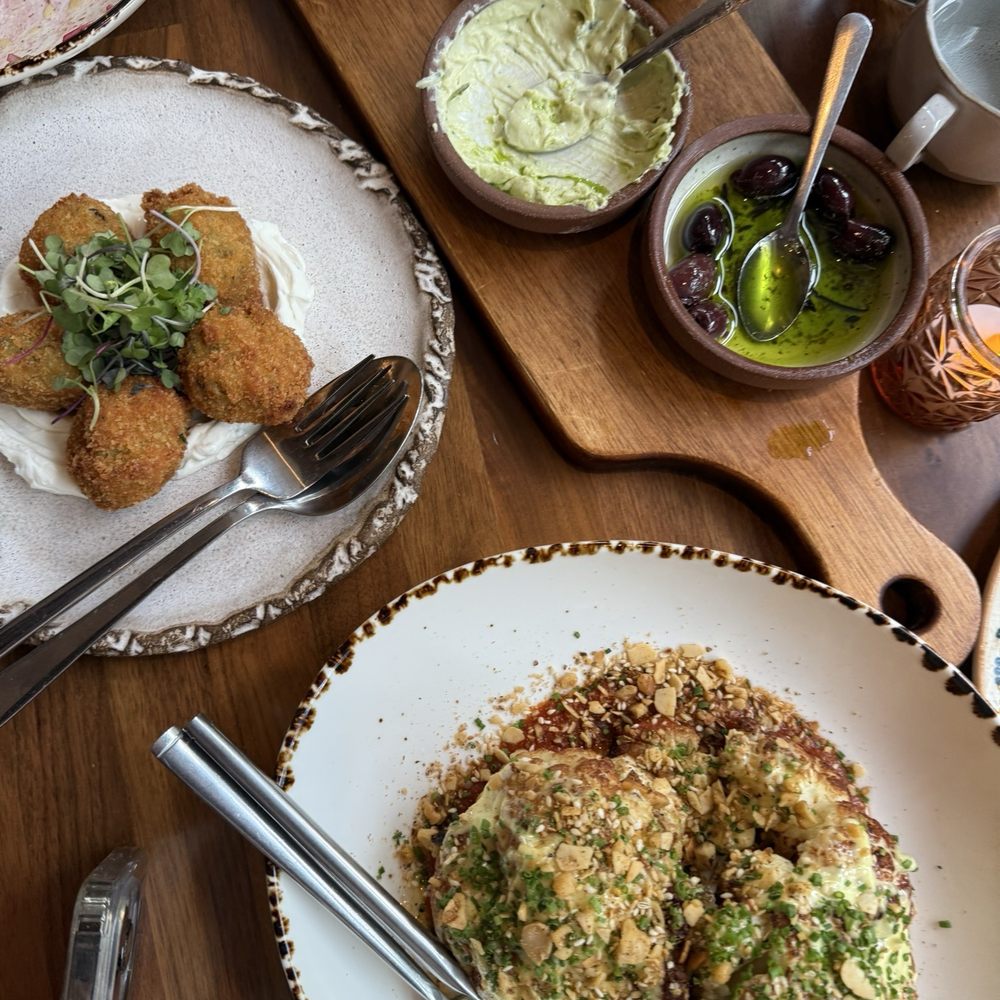 Yasemi, A Modern Mediterranean Restaurant - Zucchini fritters, 3 dip sampler, charred cauliflower - Mediterranean Near Me - Chicago, Illinois Yasemi, A Modern Mediterranean Restaurant - Zucchini fritters, 3 dip sampler, charred cauliflower - Mediterranean Near Me - Chicago, Illinois