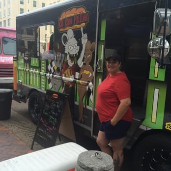 Rat Race Phillies - a woman standing in front of a food truck - Food Trucks Near Me - Jacksonville, Florida
