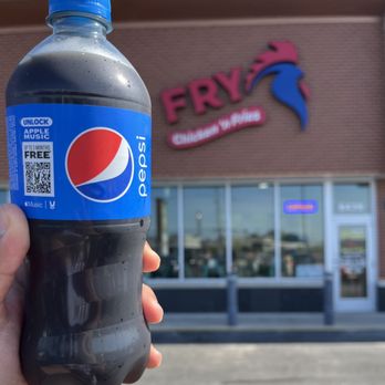 Fry Chicken Fries - a hand holding a bottle of pepsi - Chicken Shop Near Me - Niles, Illinois Fry Chicken Fries - a hand holding a bottle of pepsi - Chicken Shop Near Me - Niles, Illinois