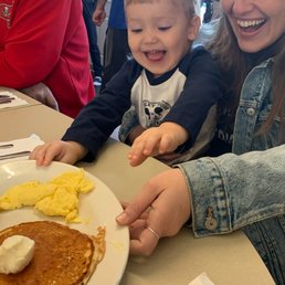He loved the pancakes and some good sausage!