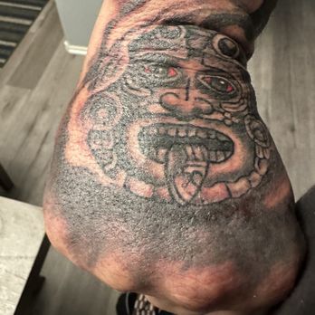 Entombed Tattoo - Hand Tat-Aztec Sun God - Tattoo Near Me - Las Vegas, Nevada Entombed Tattoo - Hand Tat-Aztec Sun God - Tattoo Near Me - Las Vegas, Nevada