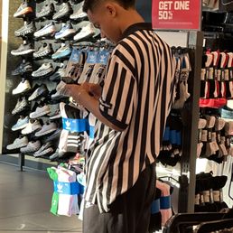 We asked this employee for help and he ignored us and got on his phone
