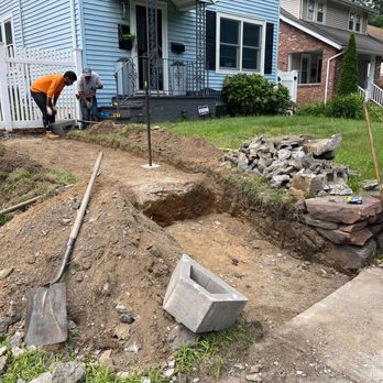Prime Landscaping & Snow Removal - two men working on a garden - Tree Services Near Me Prime Landscaping & Snow Removal - two men working on a garden - Tree Services Near Me
