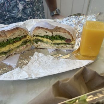The Bagel Shop - Pesto breakfast bagel with a side of fresh of OJ - Bagels Near Me - New York, New York The Bagel Shop - Pesto breakfast bagel with a side of fresh of OJ - Bagels Near Me - New York, New York