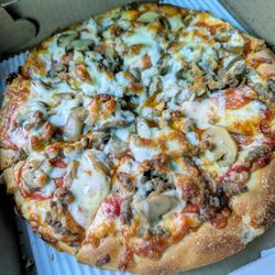 New Village Pizza and Grill - Small mushroom, pepperoni, sausage, and extra cheese pie.