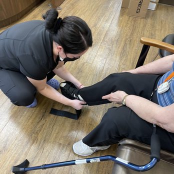 Suburban Orthopaedics - Fitting a new ankle brace on mom's ankle - Orthopedists Near Me - Bartlett, Illinois