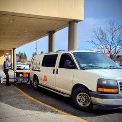 Capitol City Air Cargo and Shuttle Service - Capitol City Cargo van illegally parked in front of Postal Dropoff Box Fred Meyers Idaho Falls