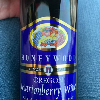 Liquor Stores - a hand holding a bottle of wine - Beer, Wine & Spirits Near Me - Newport, Oregon Liquor Stores - a hand holding a bottle of wine - Beer, Wine & Spirits Near Me - Newport, Oregon