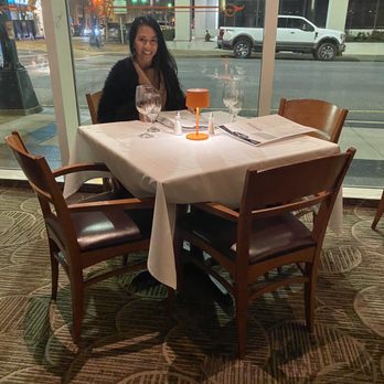 B Christopher's - Table seating by window. - American Near Me - Greensboro, North Carolina B Christopher's - Table seating by window. - American Near Me - Greensboro, North Carolina