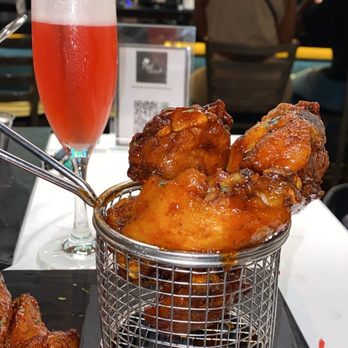Papi Cuisine - hot honey old bay wings with strawberry lemon drop - Cocktail Bars Near Me - Baltimore, Maryland