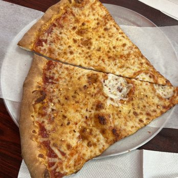 Fratellos Pizza Ucf - two slices of cheese pizza - Pizza Near Me - Orlando, Florida Fratellos Pizza Ucf - two slices of cheese pizza - Pizza Near Me - Orlando, Florida