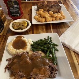 Reuben and tots. Open-faced roast beef on good bread with gravy, fresh vegetables. Reuben and tots. Open-faced roast beef on good bread with gravy, fresh vegetables.