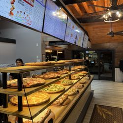 Pizza selection at counter