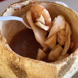 El Carretón Mariscos - Seafood cocktail inside a coconut