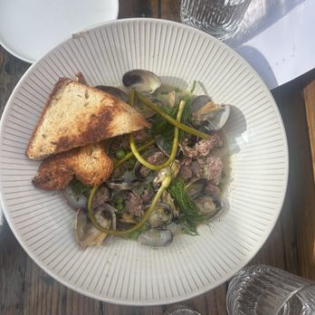 Molotov Kitschen and Cocktails - Clambasa littleneck clams, double rich pork broth, kielbasa, horseradish beurre blanc - Modern European Near Me - Denver, Colorado