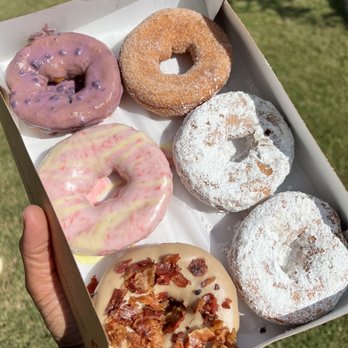 Duck Donuts - Blueberry Lemonade, Maple Bacon, powdered sugar & cinnamon sugar - Donuts Near Me - Cary, North Carolina Duck Donuts - Blueberry Lemonade, Maple Bacon, powdered sugar & cinnamon sugar - Donuts Near Me - Cary, North Carolina