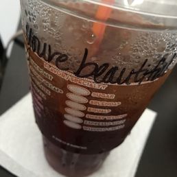 a drink in a plastic cup a drink in a plastic cup