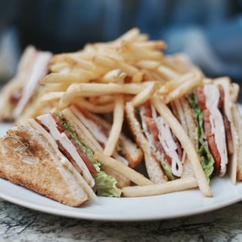 Living Room - Turkey Club Sandwich. Layered meats, cheeses, and vegetables between toasted bread. It was actually pretty good! - Lounges Near Me - Los Angeles, California Living Room - Turkey Club Sandwich. Layered meats, cheeses, and vegetables between toasted bread. It was actually pretty good! - Lounges Near Me - Los Angeles, California