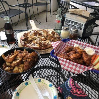 BottleDog Bites & Brews - Left to right: Hot chicken poutine, the James flatbread, and buffalo wings. - Beer Bar Near Me - Cary, North Carolina