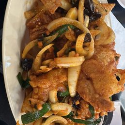 Spicy shrimp (there's stale doritos in the dish)
