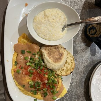 Another Broken Egg Cafe - Mardi Gras Omelette with grits - Breakfast & Brunch Near Me - Fishers, Indiana