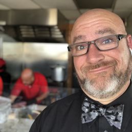 Me ordering inside and watching them prepare the entrees. Me ordering inside and watching them prepare the entrees.