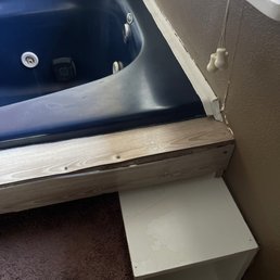 Wood coming apart and peeling whatever that white stuff is around jacuzzi. Wood coming apart and peeling whatever that white stuff is around jacuzzi.