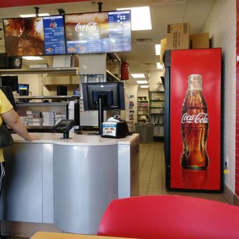 Domino's Pizza - a woman standing at a counter - Pizza Near Me - McDonough, Georgia