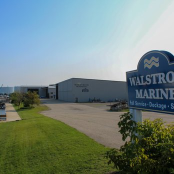 Walstrom Marine - Exterior Photo Aug 2021 with Road Sign - Boat Repair Near Me - Cheboygan, Michigan Walstrom Marine - Exterior Photo Aug 2021 with Road Sign - Boat Repair Near Me - Cheboygan, Michigan