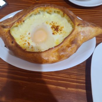 Georgian Bread Cuisine - Cheese bread with poached egg - Georgian Near Me - Philadelphia, Pennsylvania Georgian Bread Cuisine - Cheese bread with poached egg - Georgian Near Me - Philadelphia, Pennsylvania