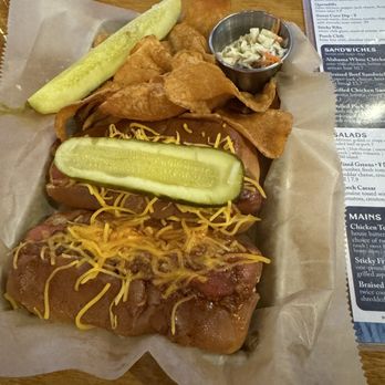The Blue Porch Bar & Grill - Loaded Hot Dog & Chili Dog, served with chips, cole slaw and a pickle spear - Bars Near Me - Grand Haven, Michigan The Blue Porch Bar & Grill - Loaded Hot Dog & Chili Dog, served with chips, cole slaw and a pickle spear - Bars Near Me - Grand Haven, Michigan