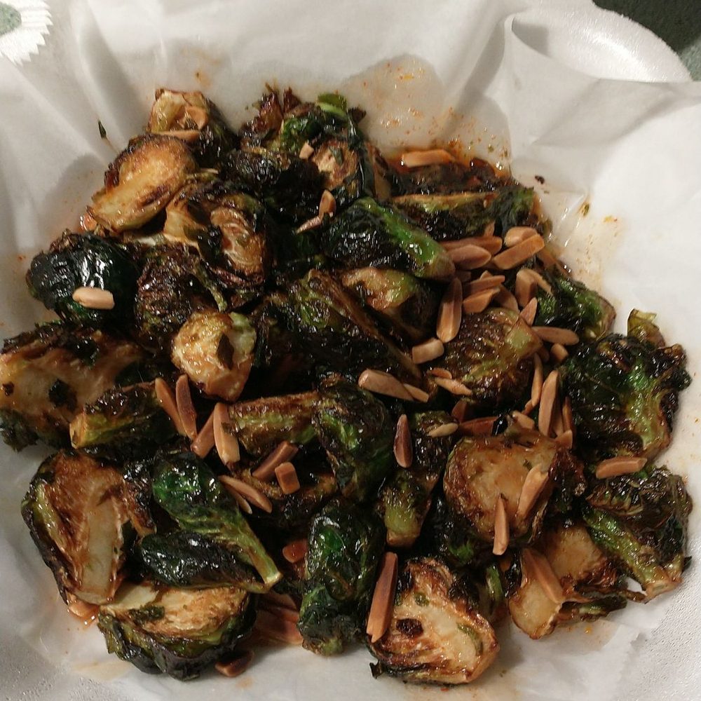 Dough Daddy's Pizza - Amazing fried brussel sprouts appetizer with honey, gochujang with crunchy almond slivers. This is an absolute must!!!!! - Pizza Near Me - Westmont, Illinois