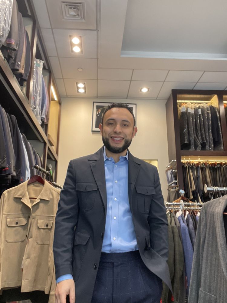Raymond Personal Tailor & Men's Clothing Store Logo